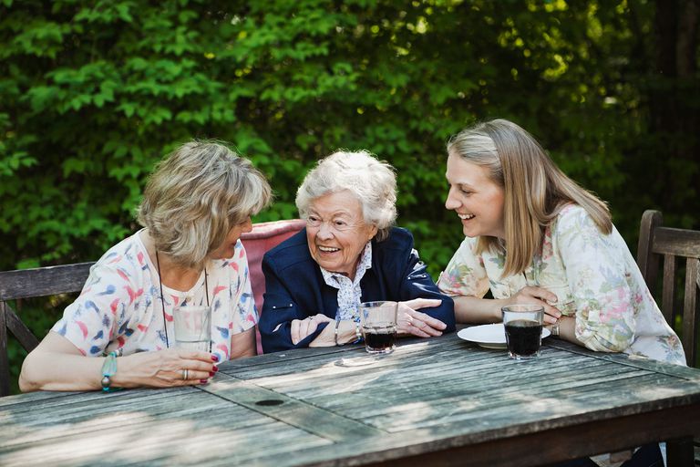An older woman with her family